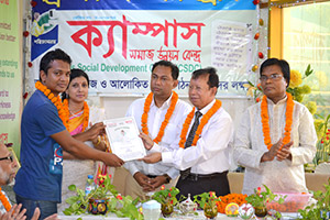 Vice-Chancellor of BUFT, Professor Dr. Syed Masud Husain and Founder Chairman of Debate for Democracy Hassan Ahamed Chowdhury Kiron, is giving Certificates to the Trainees of Free Computer Training (Batch 126+127); Dr. M Helal is presiding over. (2014)